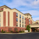 the exterior of a Hampton Inn & Suites hotel