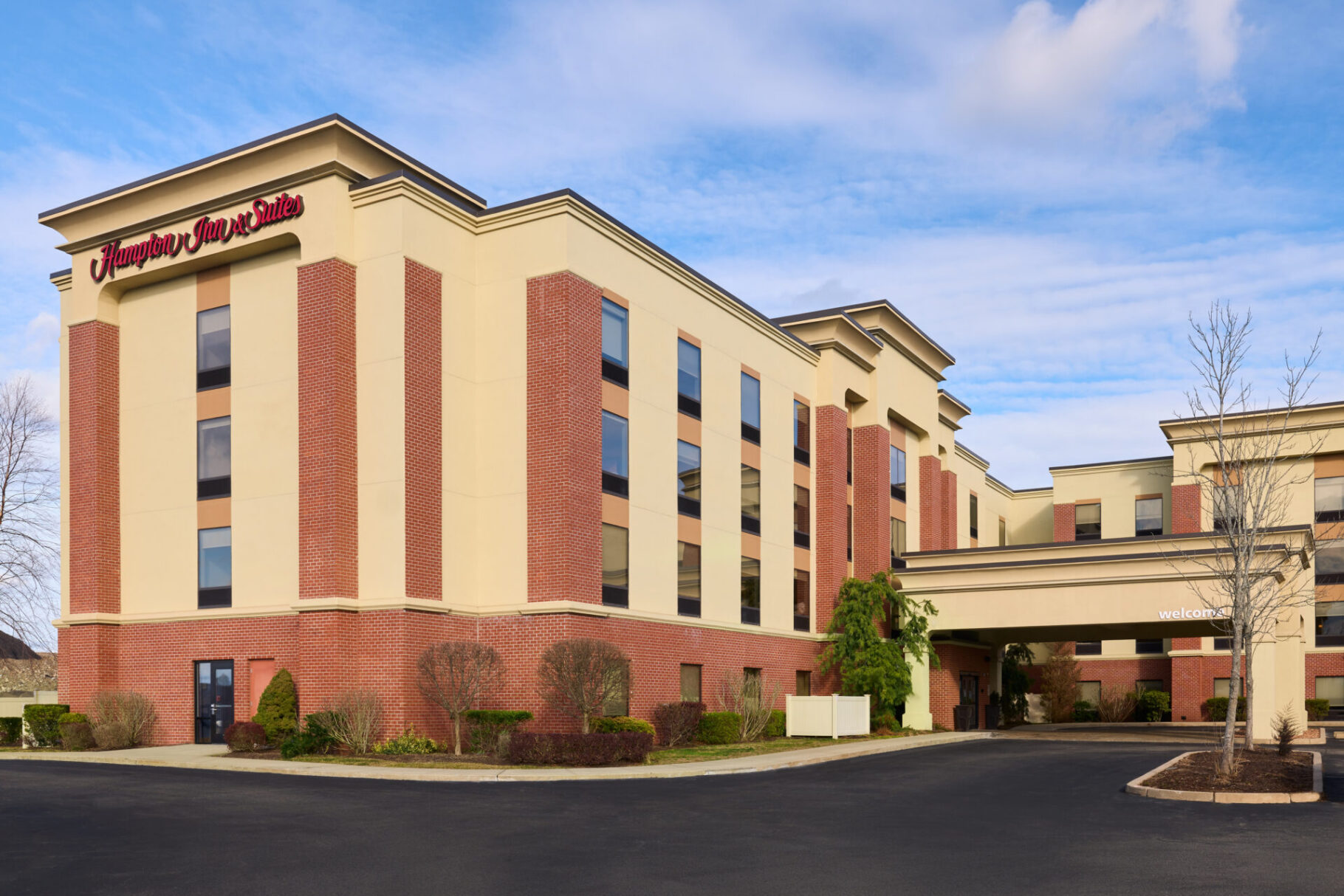 the exterior of a Hampton Inn & Suites hotel